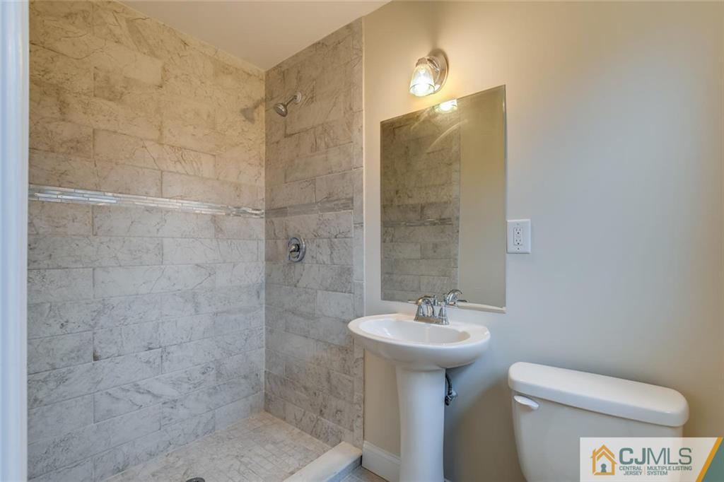 41 Emerson Road Somerset, NJ 08873 - Photo 18 of 25 a bathroom with a sink toilet and shower