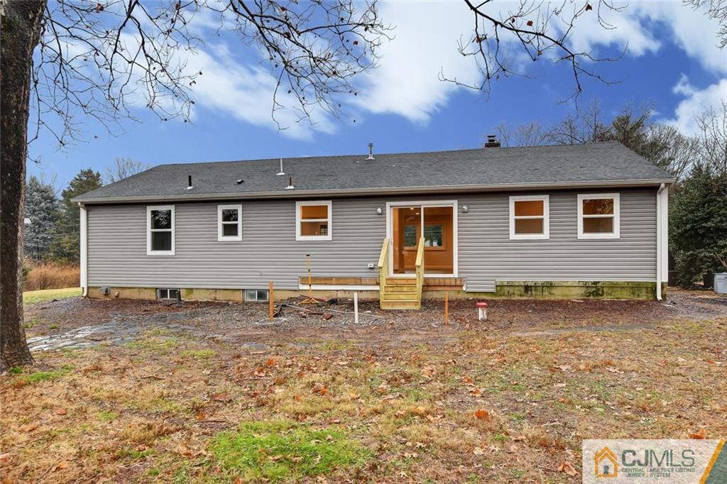 41 Emerson Road Somerset, NJ 08873 - Photo 25 of 25 a backyard of a house with table and chairs