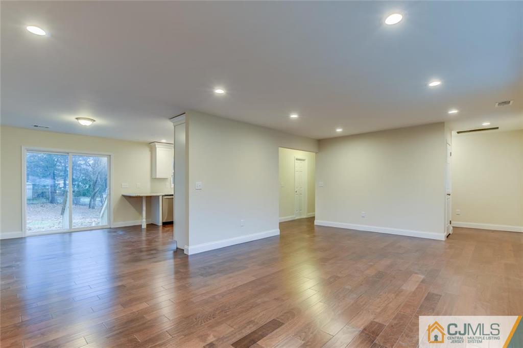 41 Emerson Road Somerset, NJ 08873 - Photo 7 of 25 a view of an empty room with wooden floor