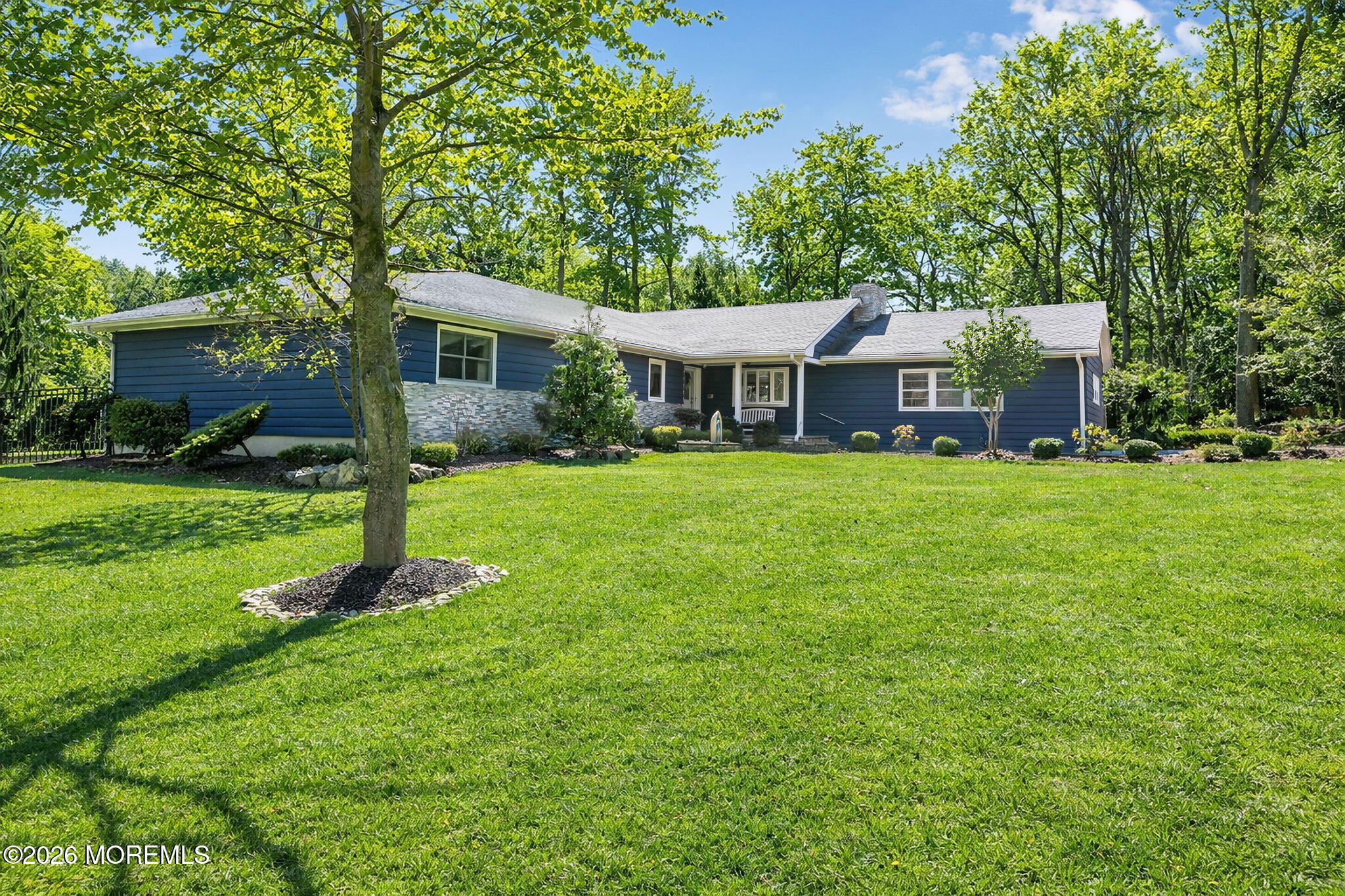 12 Crest Drive Colts Neck, NJ 07722 - Photo 1 of 77 a front view of a house with a yard tree and green space