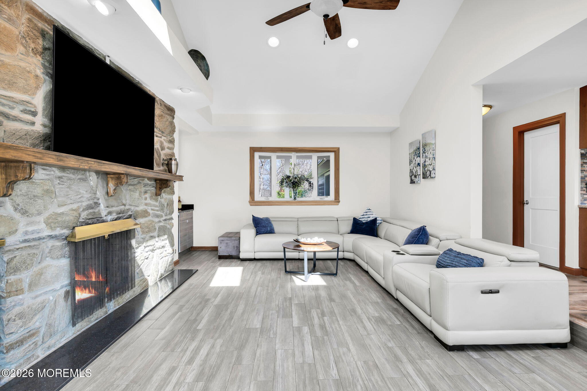 12 Crest Drive Colts Neck, NJ 07722 - Photo 12 of 77 a living room with furniture fireplace and flat screen tv