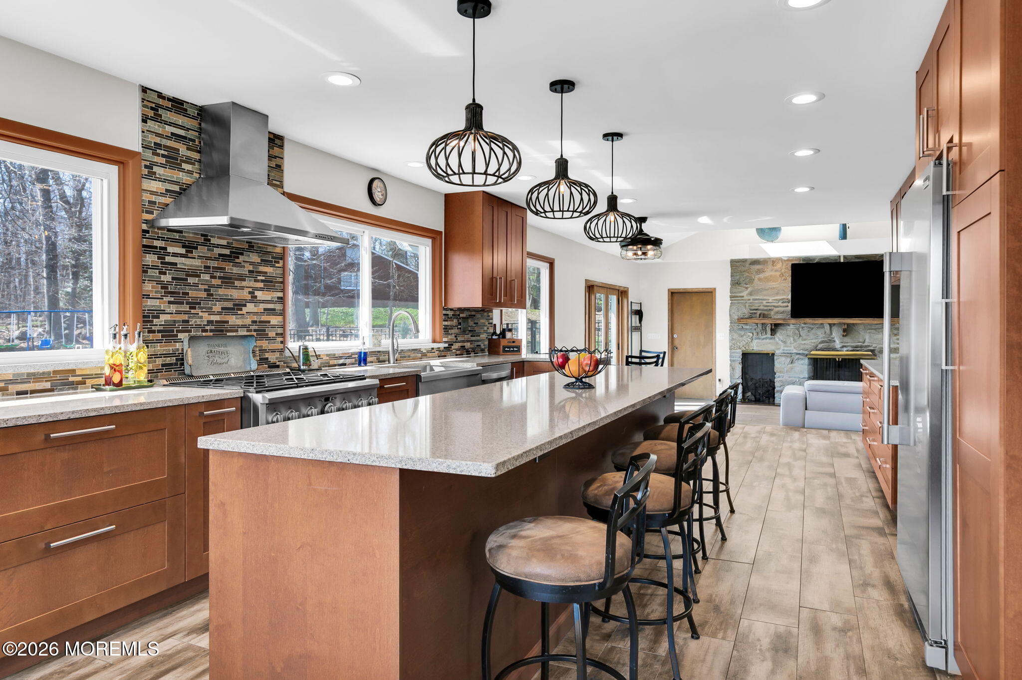 12 Crest Drive Colts Neck, NJ 07722 - Photo 20 of 77 a large kitchen with a table and chairs in it