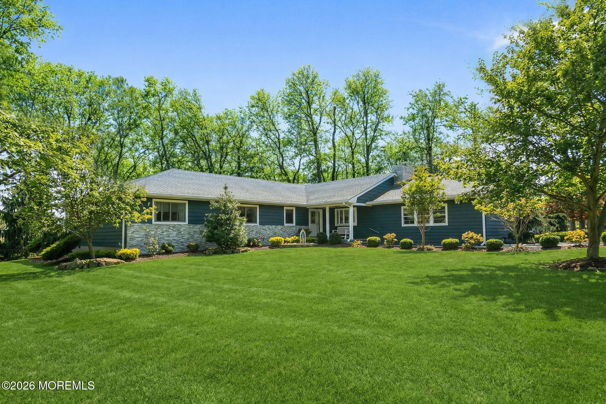 12 Crest Drive Colts Neck, NJ 07722 - Photo 2 of 77 a view of a big house with a big yard and large trees