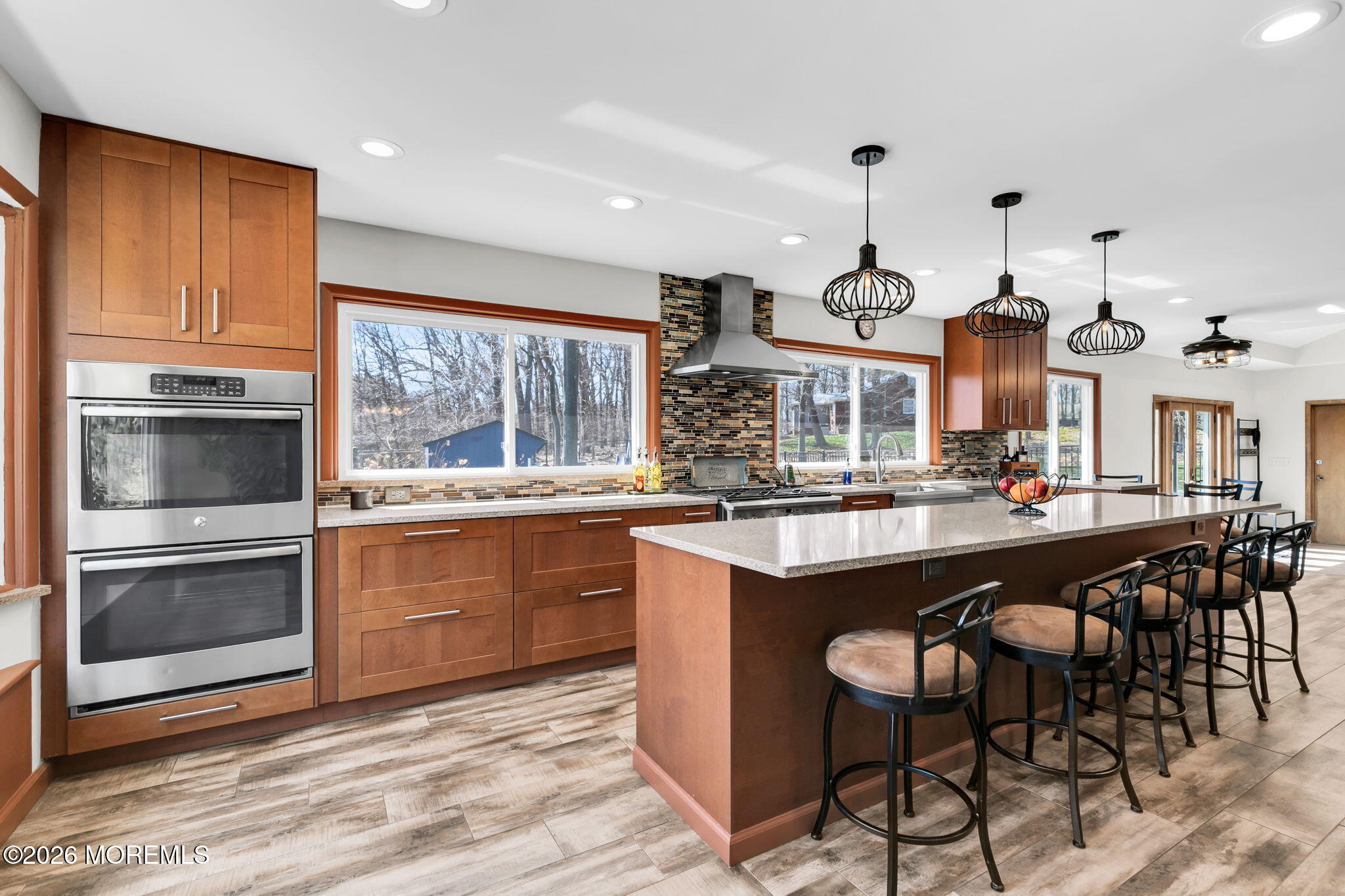 12 Crest Drive Colts Neck, NJ 07722 - Photo 21 of 77 a kitchen with stainless steel appliances granite countertop a stove a sink and a refrigerator