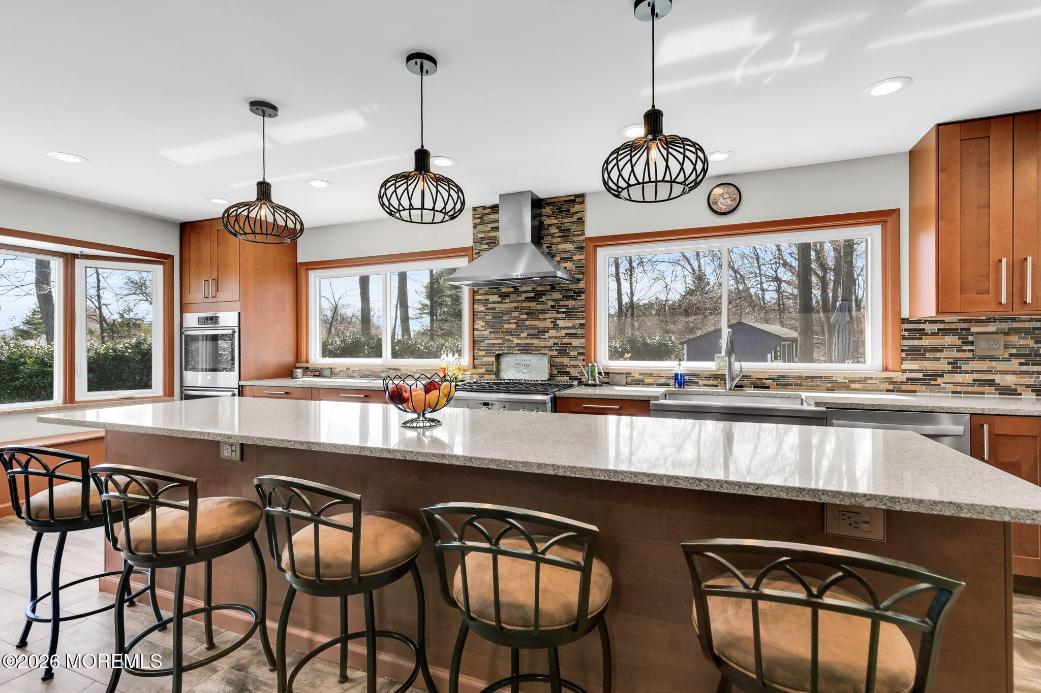 12 Crest Drive Colts Neck, NJ 07722 - Photo 26 of 77 a very nice looking kitchen with granite countertop a stove two sinks and a chandelier