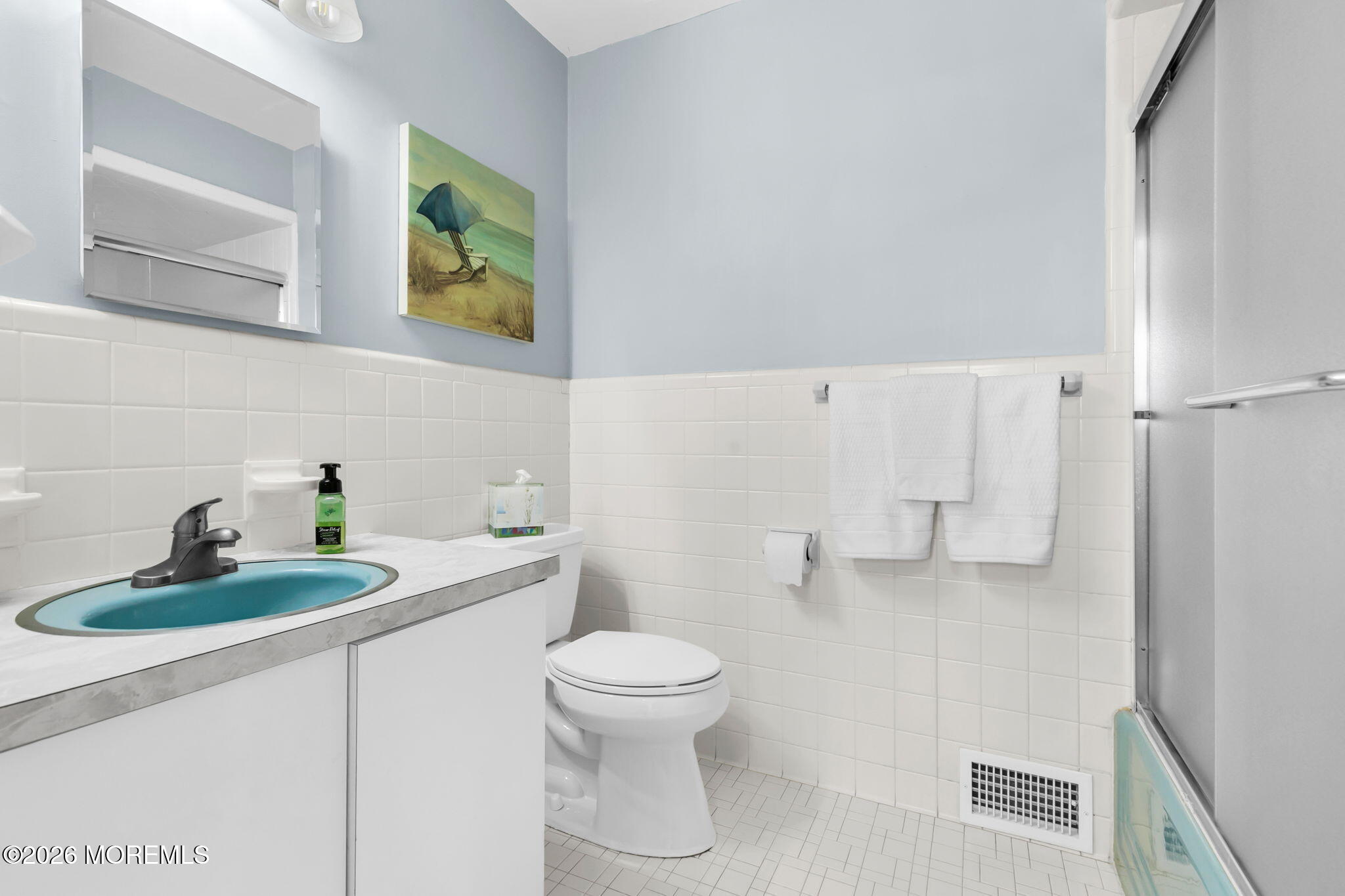 12 Crest Drive Colts Neck, NJ 07722 - Photo 33 of 77 a bathroom with a sink a toilet and a mirror