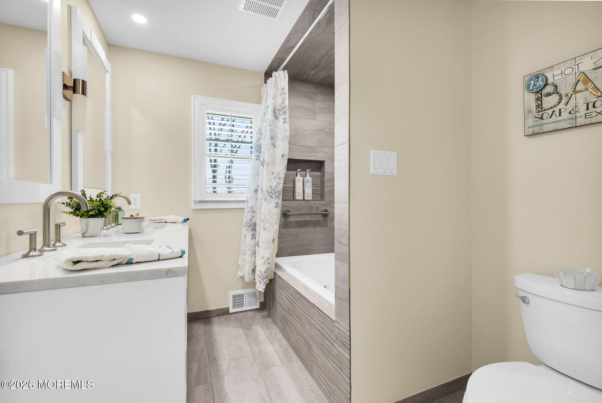 12 Crest Drive Colts Neck, NJ 07722 - Photo 37 of 77 a bathroom with a sink a toilet and tub