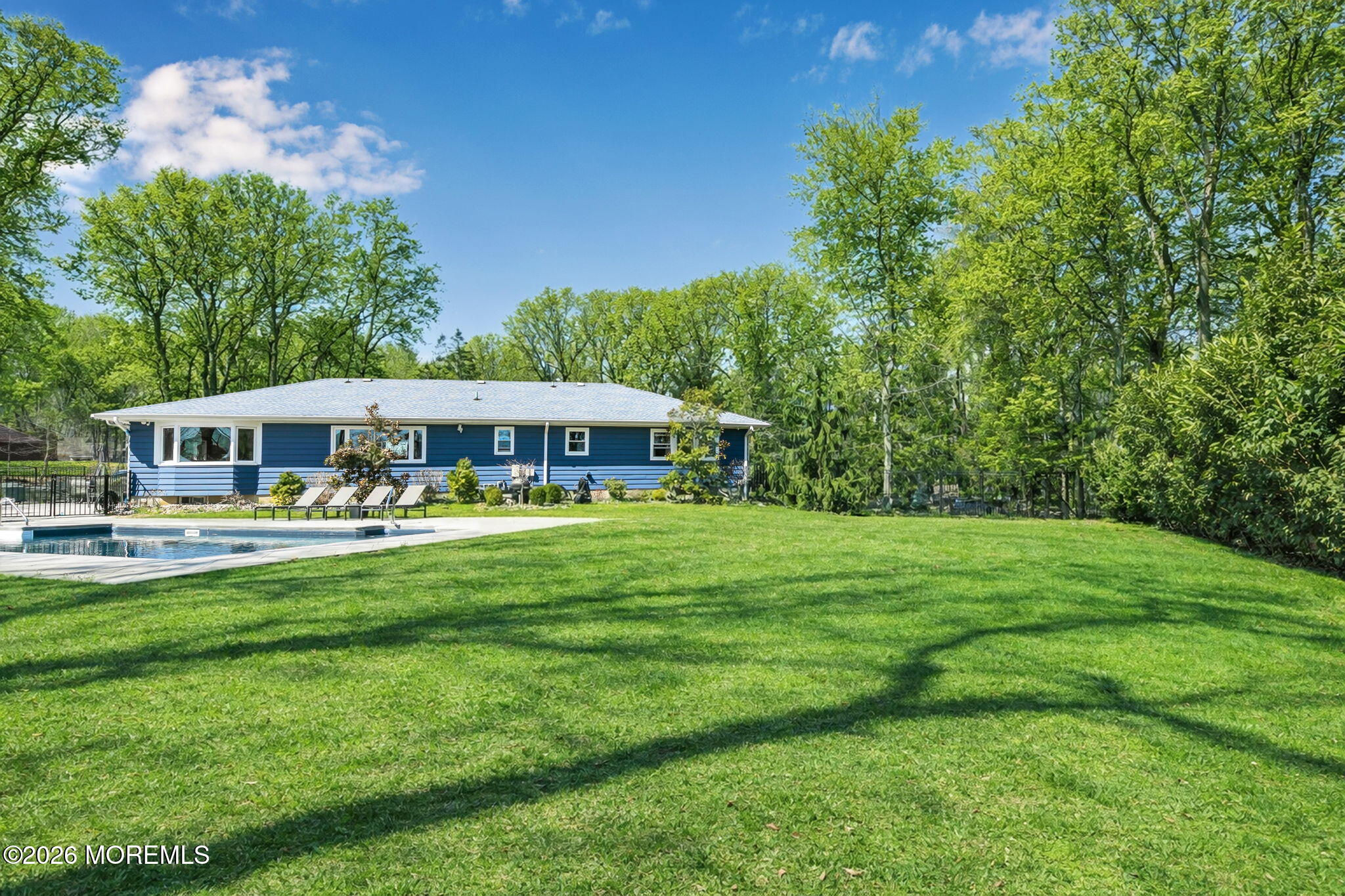 12 Crest Drive Colts Neck, NJ 07722 - Photo 5 of 77 a front view of a house with a garden