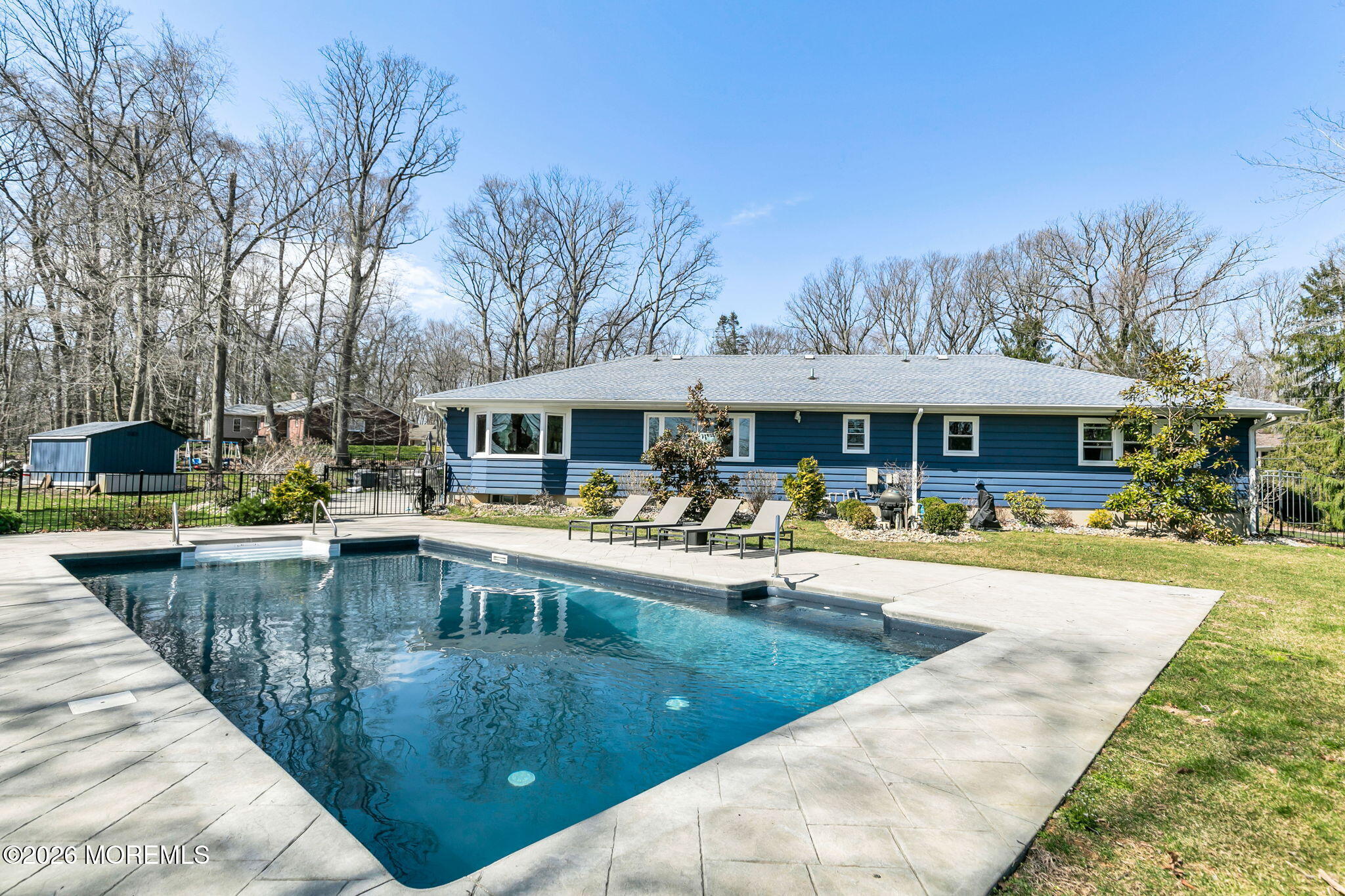12 Crest Drive Colts Neck, NJ 07722 - Photo 51 of 77 a view of a house with swimming pool and sitting area