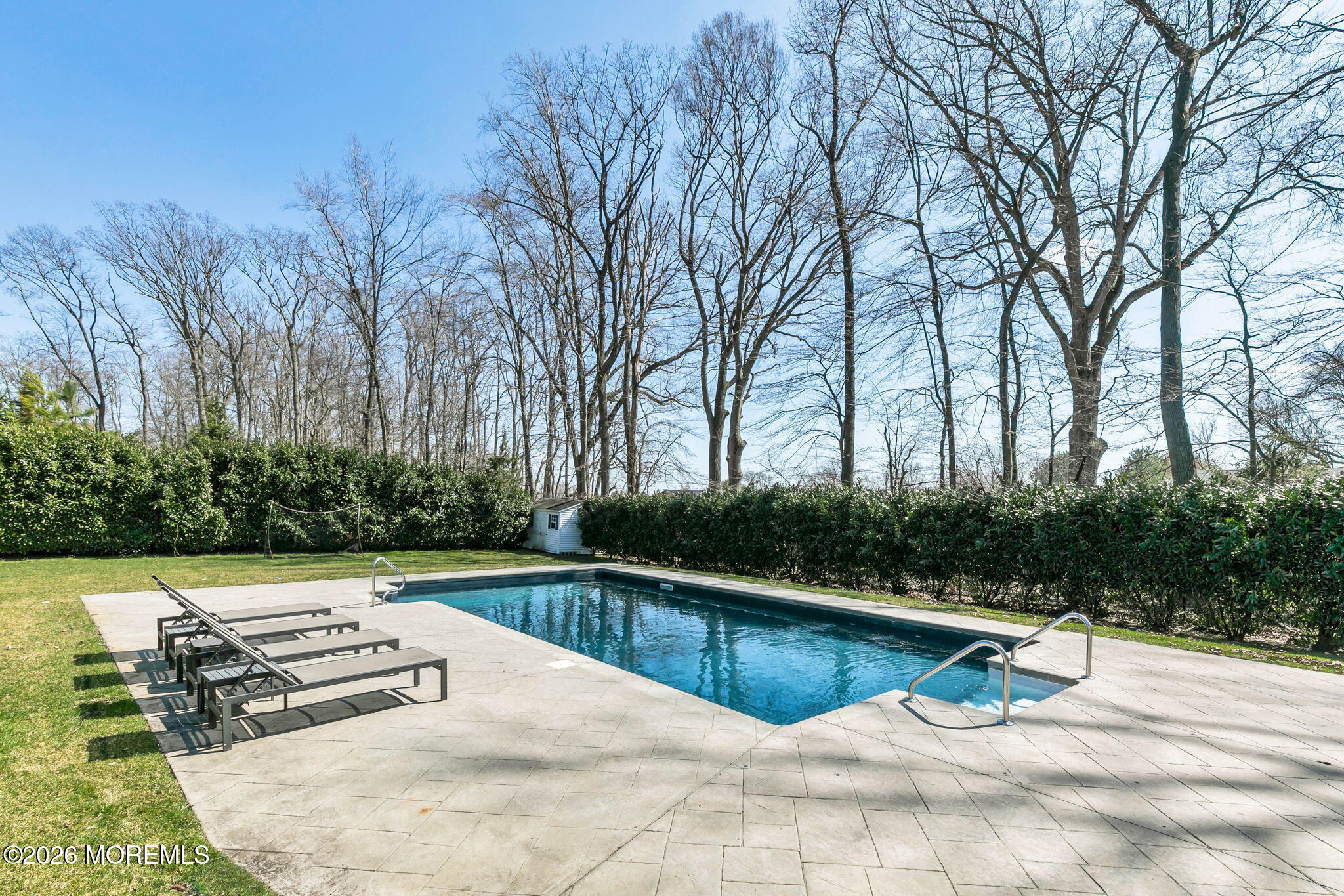 12 Crest Drive Colts Neck, NJ 07722 - Photo 54 of 77 a view of a swimming pool with a yard
