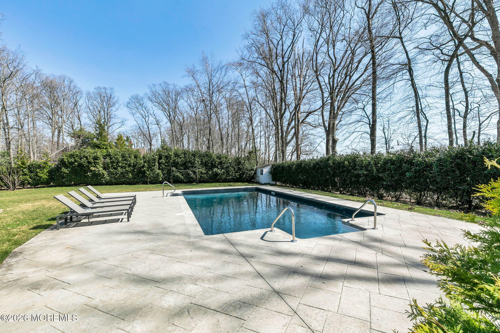 12 Crest Drive Colts Neck, NJ 07722 - Photo 57 of 77 a view of swimming pool with chairs and trees