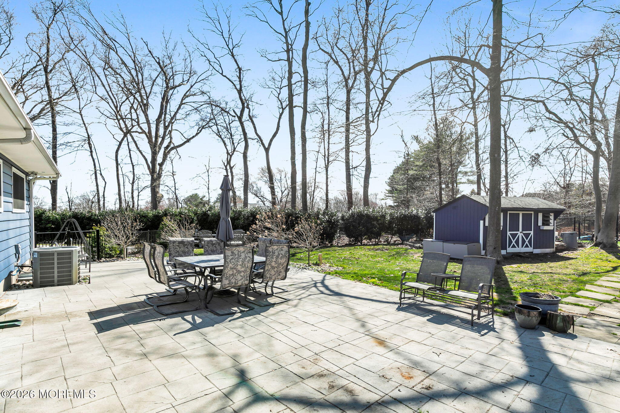 12 Crest Drive Colts Neck, NJ 07722 - Photo 58 of 77 a view of a backyard with sitting area