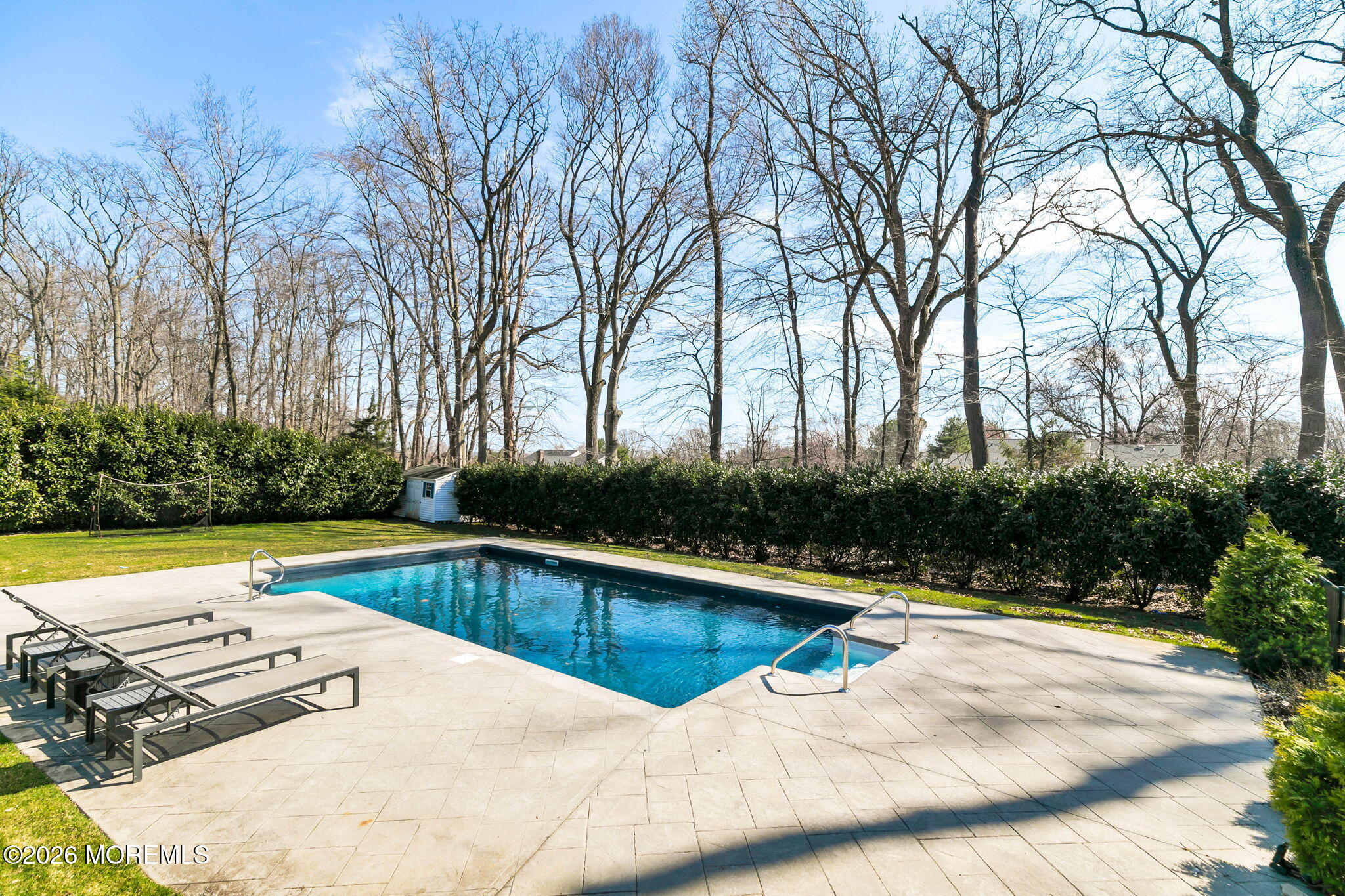 12 Crest Drive Colts Neck, NJ 07722 - Photo 63 of 77 a view of a swimming pool with a patio and yard