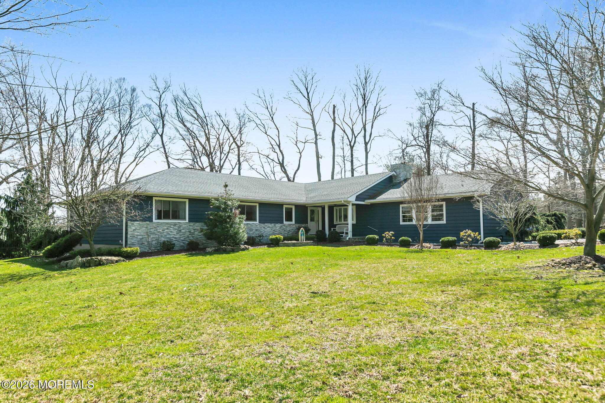 12 Crest Drive Colts Neck, NJ 07722 - Photo 65 of 77 a front view of a house with a yard