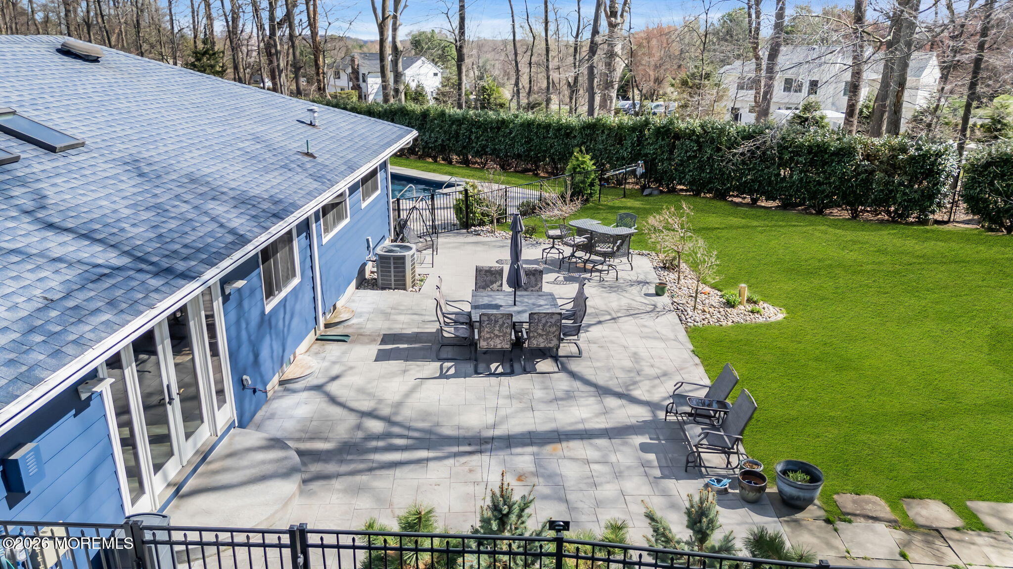 12 Crest Drive Colts Neck, NJ 07722 - Photo 72 of 77 a view of a patio with couches table and chairs and potted plants