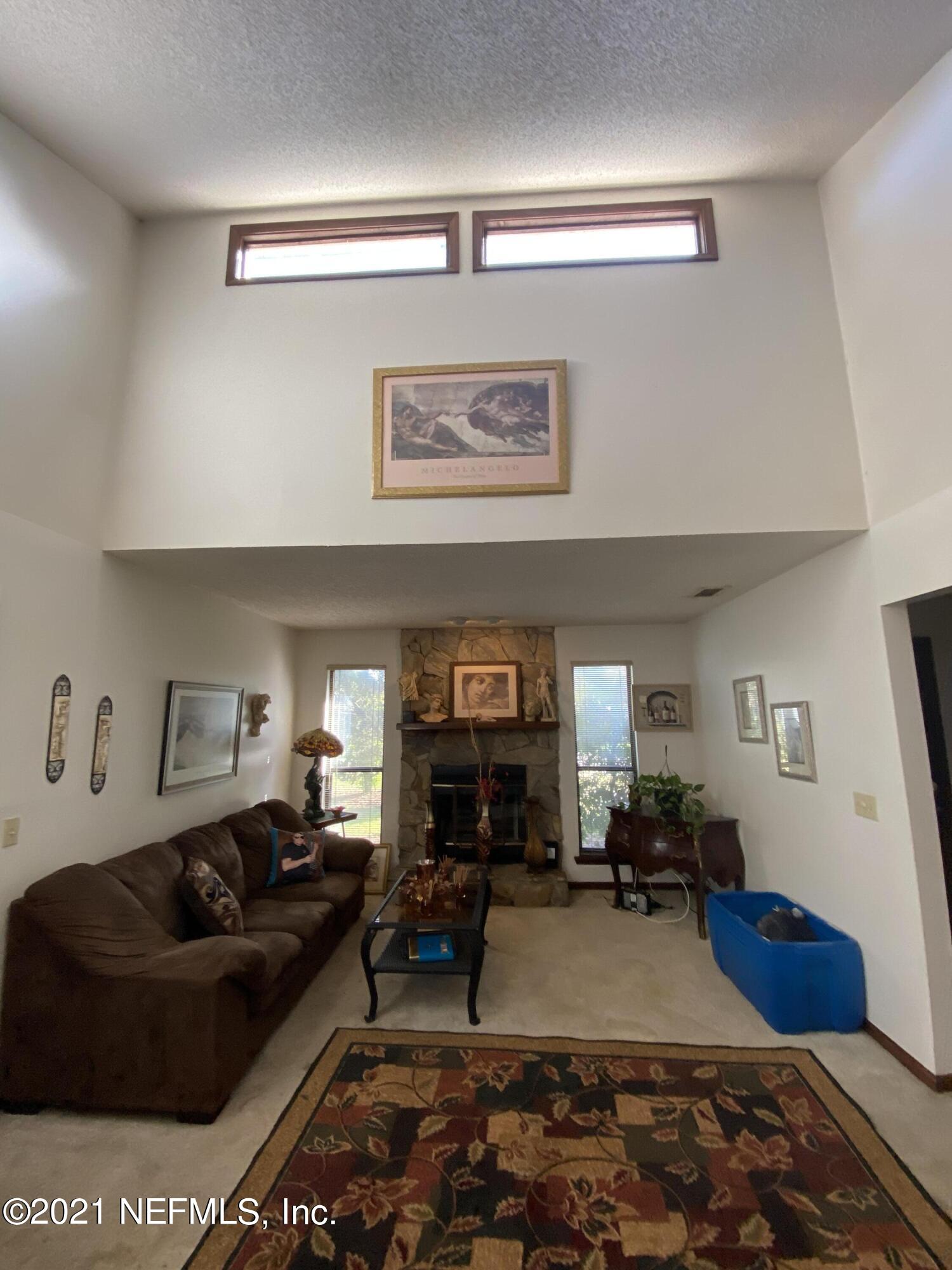 8219 Crosswind Road Jacksonville, FL 32244 - Photo 3 of 26 Family room w/ vaulted ceilings