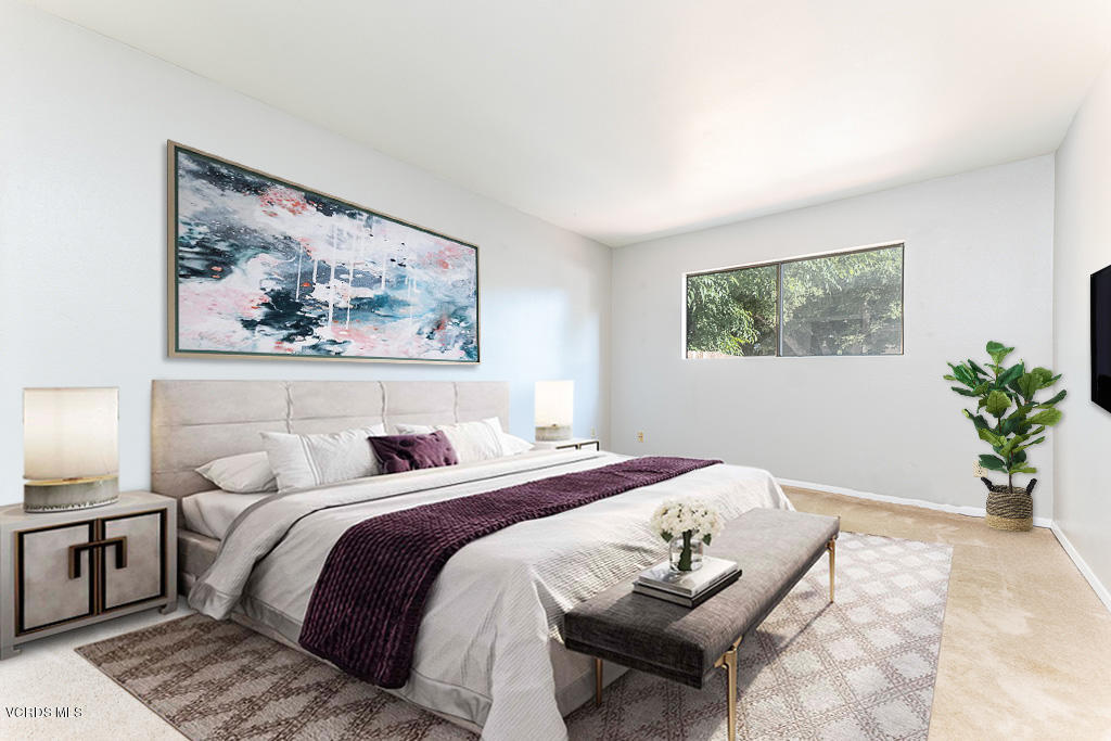 6400 Katherine Road, Unit C Simi Valley, CA 93063 - Photo 11 of 26 a bedroom with a bed and a painting on the wall