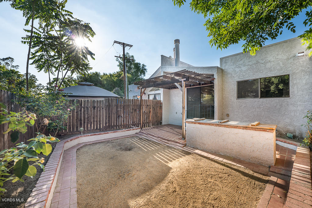 6400 Katherine Road, Unit C Simi Valley, CA 93063 - Photo 19 of 26 a view of a house with a wooden fence
