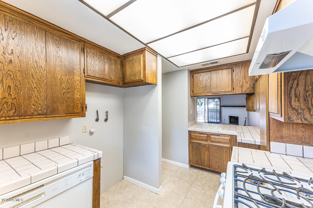6400 Katherine Road, Unit C Simi Valley, CA 93063 - Photo 10 of 26 a kitchen with a stove and a refrigerator