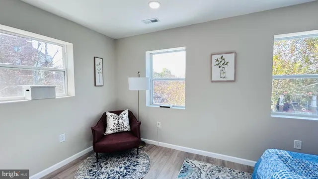 a bathroom with a bathtub and a window
