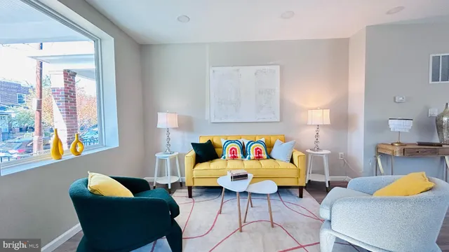 a living room with furniture and a window