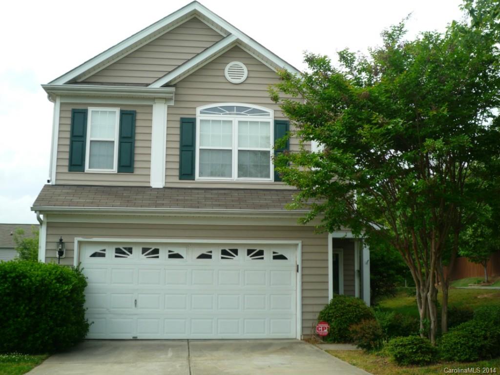 3102 Tanzanite Circle Fort Mill, SC 29708 - Photo 1 of 18 a front view of a house with a garden