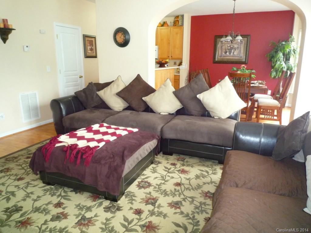 3102 Tanzanite Circle Fort Mill, SC 29708 - Photo 2 of 18 a living room with furniture and a large mirror