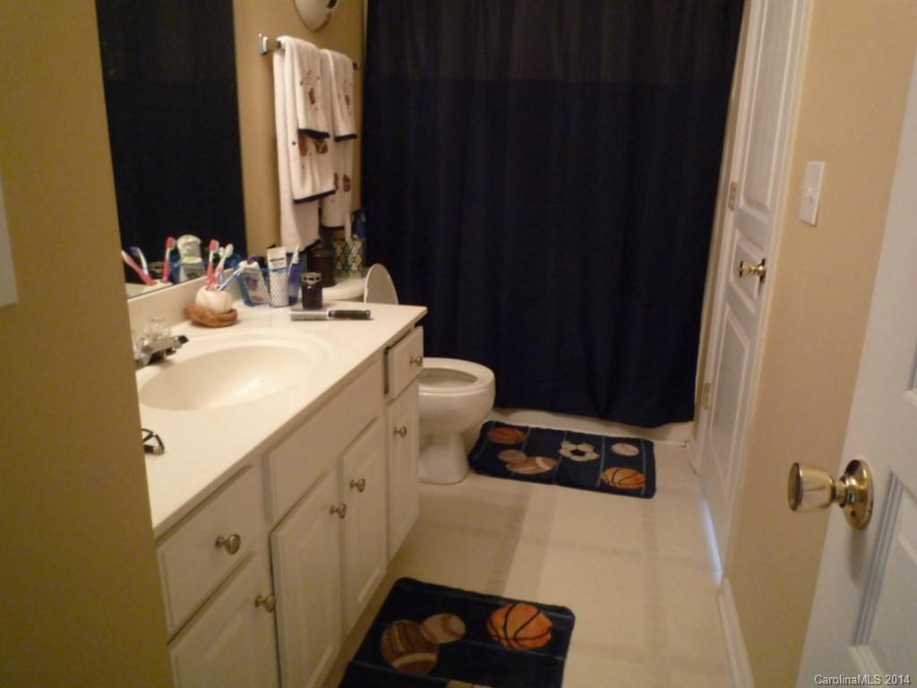 3102 Tanzanite Circle Fort Mill, SC 29708 - Photo 14 of 18 a bathroom with a sink and a mirror