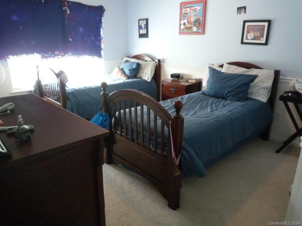 3102 Tanzanite Circle Fort Mill, SC 29708 - Photo 15 of 18 a bedroom with bed and a desk
