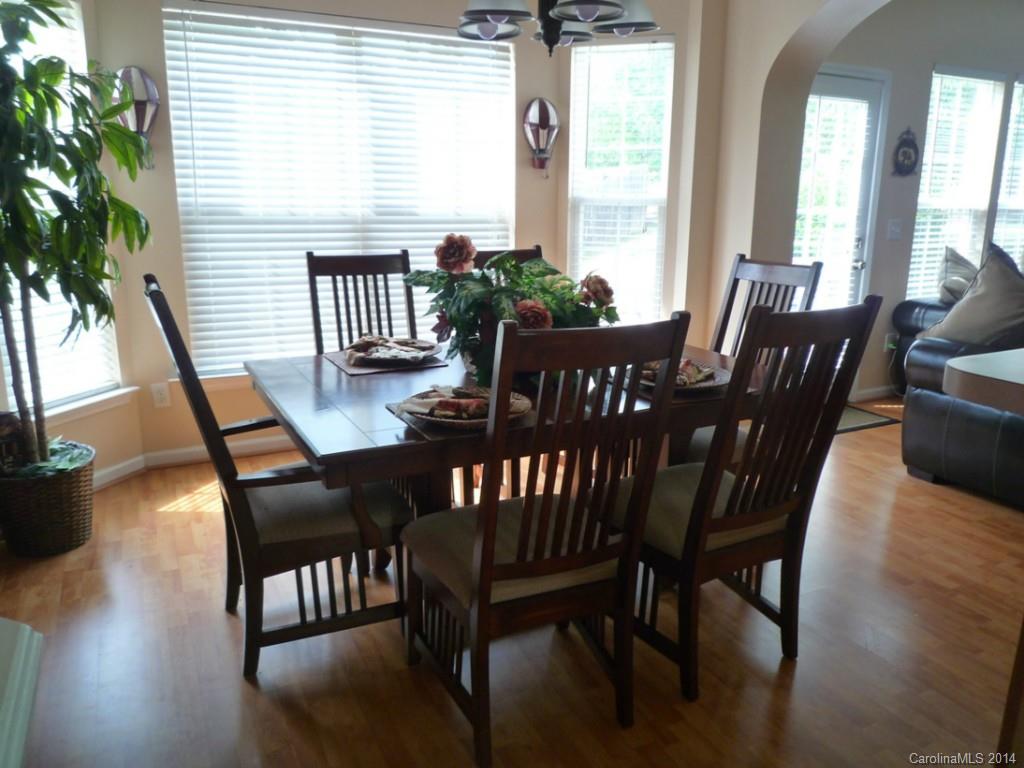3102 Tanzanite Circle Fort Mill, SC 29708 - Photo 5 of 18 a view of a dining room with furniture window and wooden floor