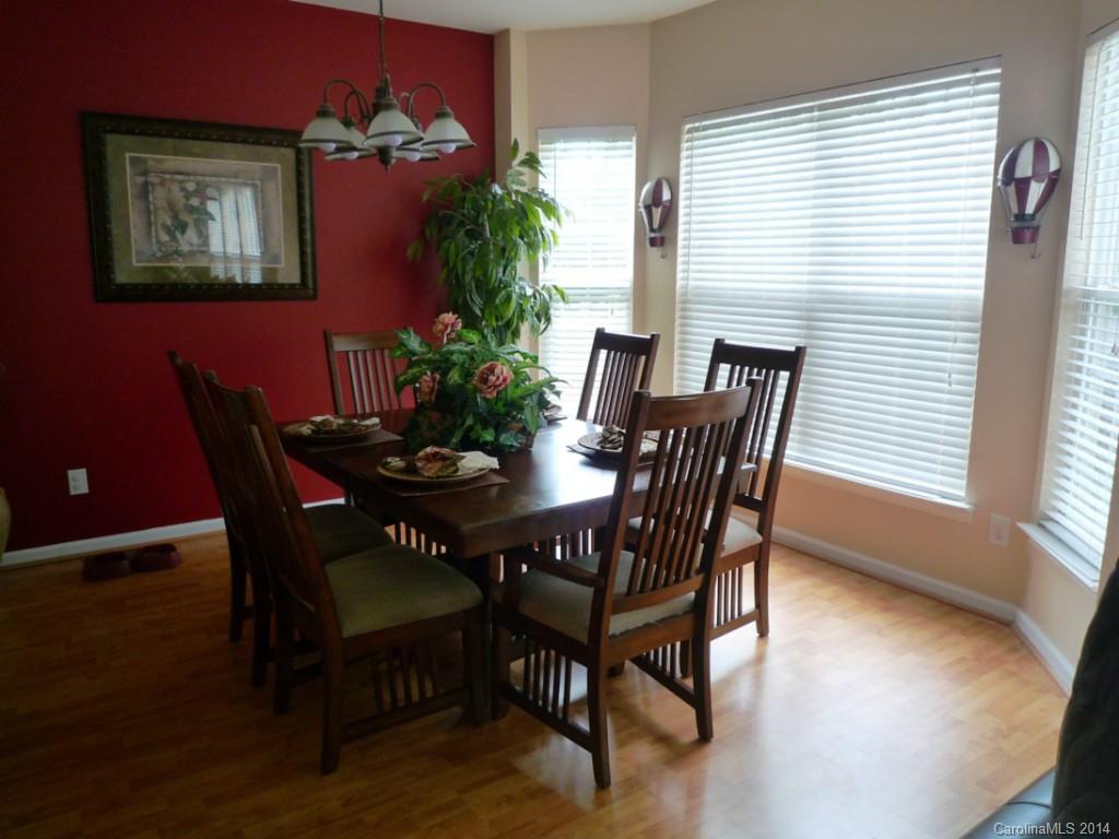 3102 Tanzanite Circle Fort Mill, SC 29708 - Photo 6 of 18 a view of a dining room with furniture and wooden floor