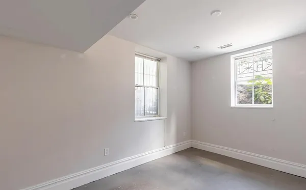 an empty room with windows