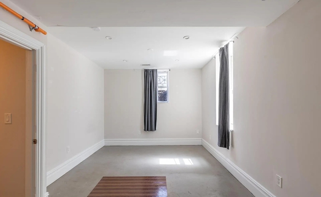 89 Cedar Street, Unit 2 Boston, MA 02119 - Photo 8 of 27 a view of an empty room