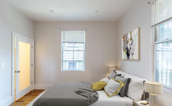 a living room with furniture and large window