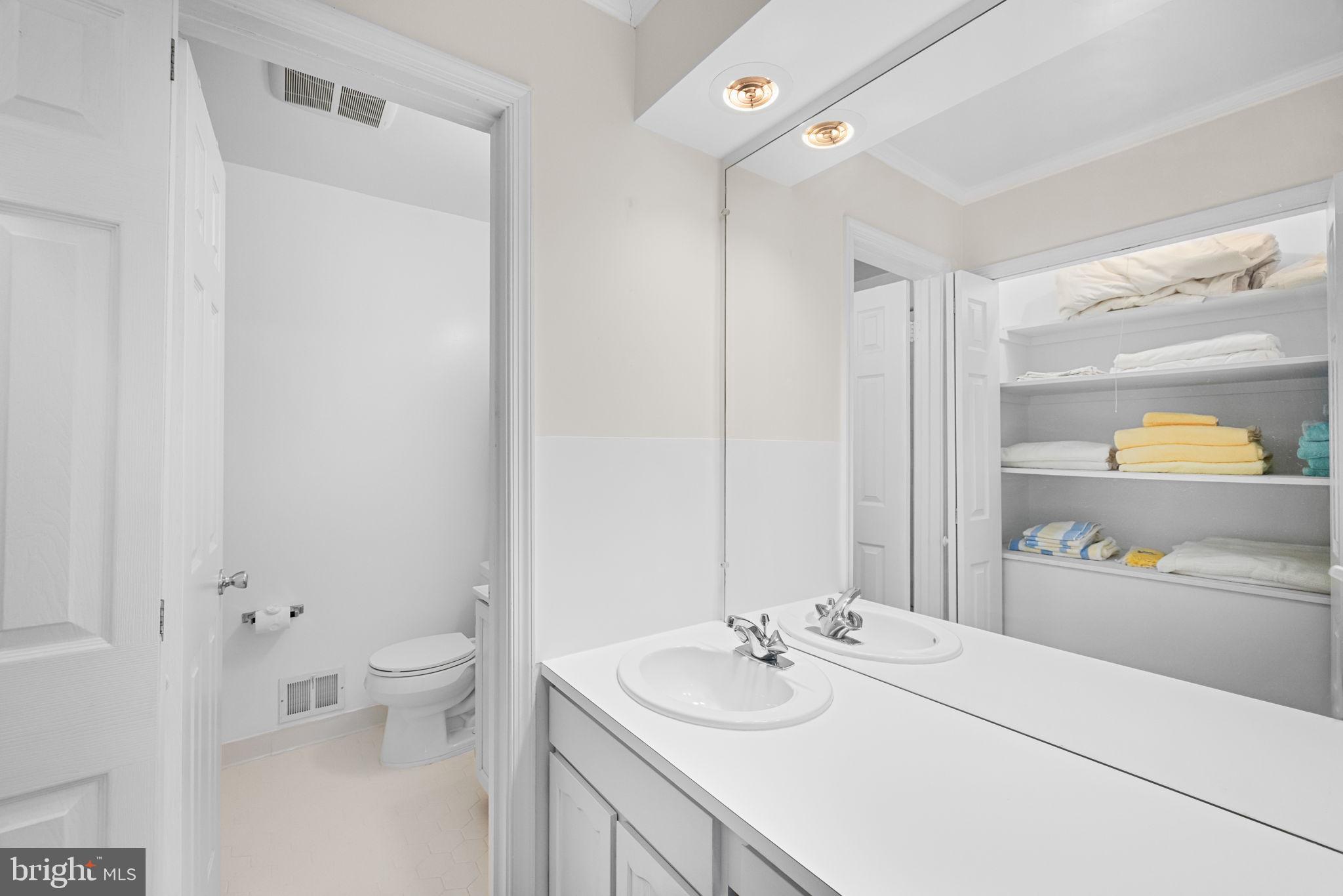 8220 Smithfield Avenue Springfield, VA 22152 - Photo 34 of 63 Full bath in hallway w/ 2 sinks & linen closet