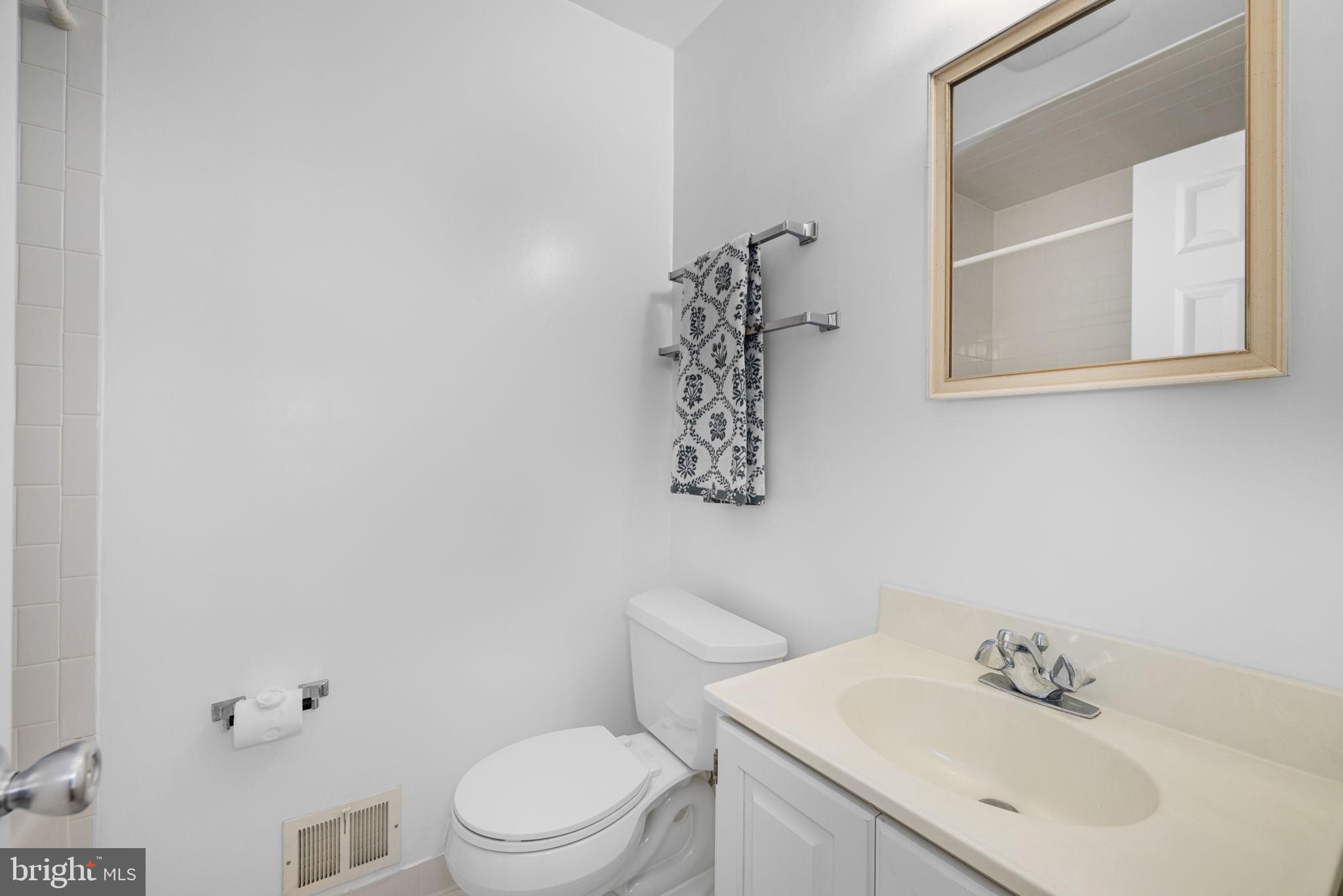 8220 Smithfield Avenue Springfield, VA 22152 - Photo 35 of 63 Full bath in hallway w/ 2 sinks & linen closet