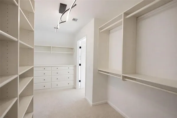 a view of an empty walk in closet