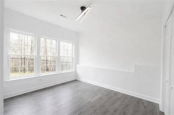 a view of an empty room with a window