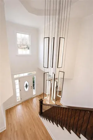 a view of a hardwood floor and staircase