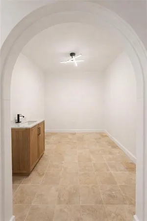 a view of a room with cabinet and mirror