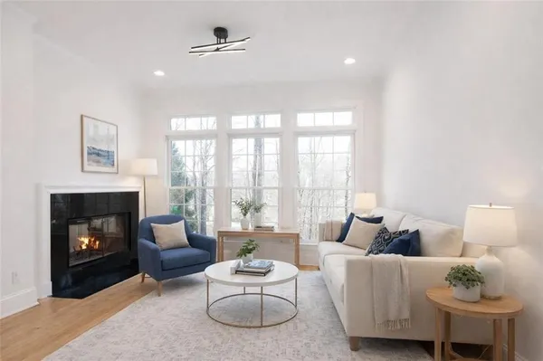 a living room with furniture and a fireplace