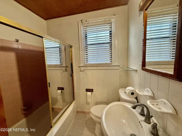 a bathroom with a sink and a tub