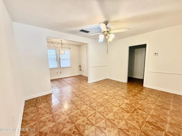 a view of an empty room with a window