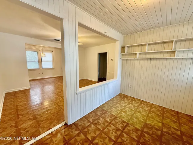 a view of an empty room with a window