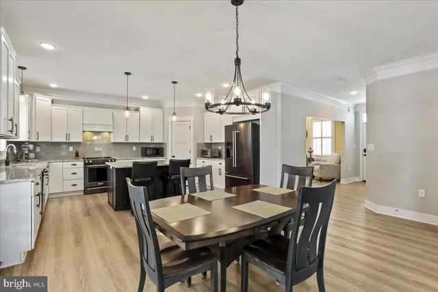 a view of a dining room and chandelier furniture