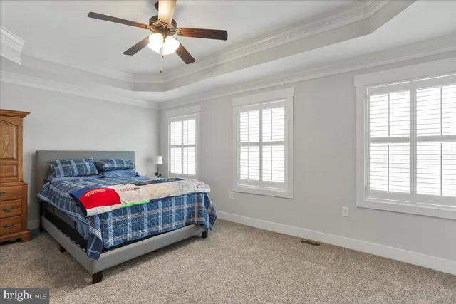 a bathroom with a granite countertop sink toilet and mirror
