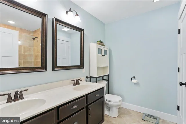 a bedroom with furniture and wooden floor
