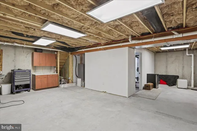 a view of patio with a table and chairs