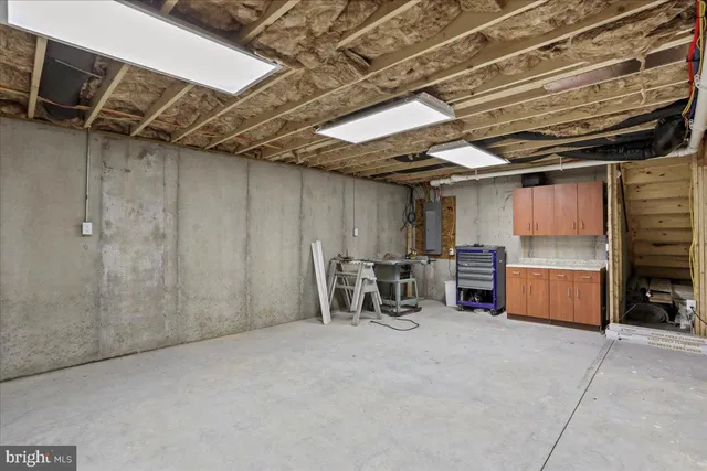 a house view with a sitting space and garden