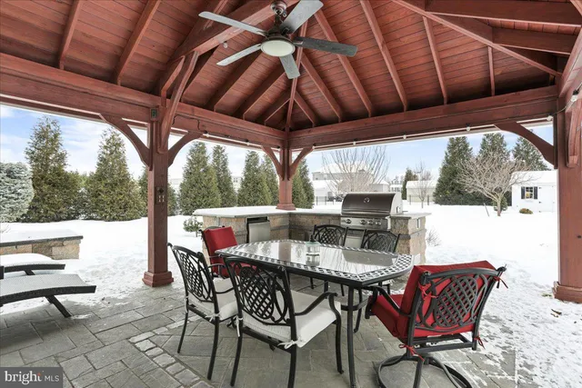 a view of a house with yard and sitting area